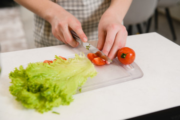 Close up hand cut tomato for salad
