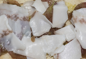 Rural breakfast wood bread toast with olive oil tomato and thin slices of Iberian bacon