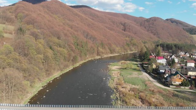 Beskids Mountains and Poprad River in spring. Village Rytro, Poland.