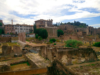 Fototapeta na wymiar The Roman Forum in the center of Ancient Rome, together with the adjacent buildings. Italy