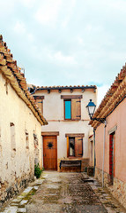 Street of town of Valladolid in the north of Spain in a cloudy day: It´s a medieval village.