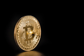 digital currency, Bitcoin, decentralized cryptocurrency, electronic money for point-to-point transactions. Coin isolated on black background.