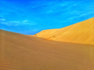 Fototapeta na wymiar Walking in sand dunes on desert