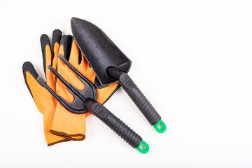 Work gloves, rake and spatula. Accessories for people working in the garden.