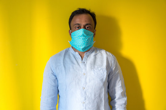 Male model wearing home made face mask to avoid infection from corona virus during corona pandemic . Covid19, Sweden