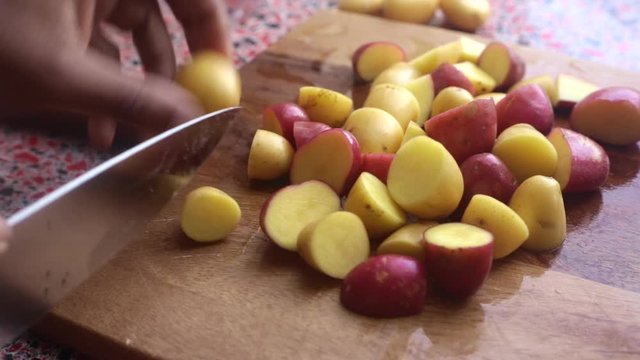 Close up person preparing vegetables to bake at home