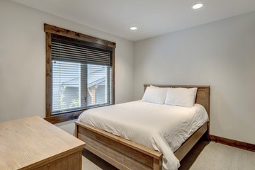 Fototapeta na wymiar Natural tone luxury bedroom interiors in new American vacation home.