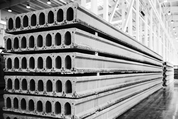 Stack of precast reinforced concrete slabs in factory workshop