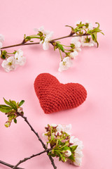heart symbol. romance and love concept. pink background with spring flowers decoration.