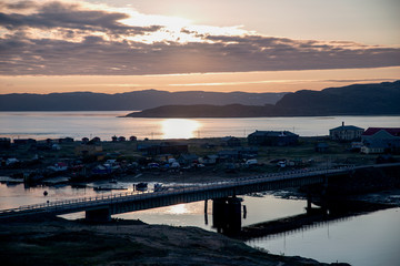 Fototapeta na wymiar Panoramic view of the fishing village and the sea at sunrise.