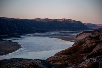 Beautiful sunrise over the river and mountains