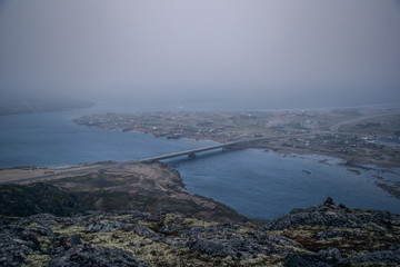 Panoramic view of the village in foggy weather in the morning. Barents Sea North Russia. Teriberka village.