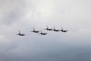 fighter jets flying in formation