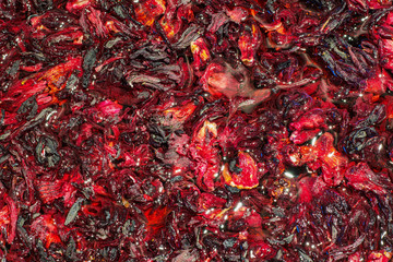 Herbal tea drink of Hibiscus, bright red, burgundy, made from dried Rosella flowers
