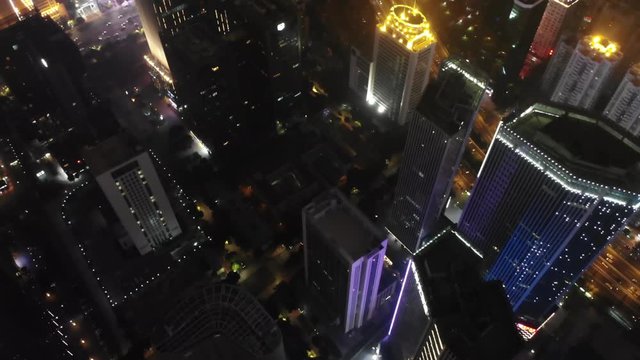 4k vertical top down aerial view of highway and overpass traffic on interchange at night in Guangzhou, China
