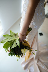 Beautiful bride with bridal bouquet in hand