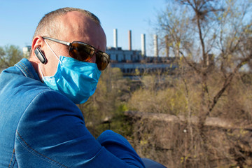 Fototapeta premium Covid-19. Pandemic. Man in medical mask and gloves