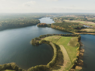 Aerial drone shot of the Ukiel lake in Olsztyn. The Masurian Lake District wchich contains more than 2,000 lakes. District had been elected as one of the 28 finalists of the New 7 Wonders of Nature