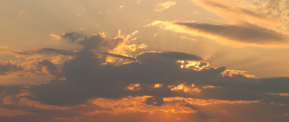 A beautiful sky with clouds and sunbeams. Sunset.