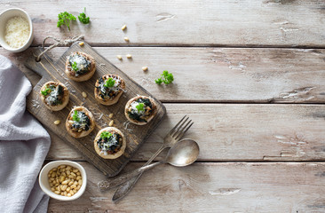 Mushrooms stuffed with ground, spinach and parmesan cheese