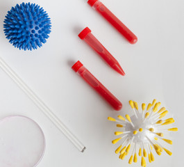 mock virus and test tubes with blood plasma on the table
