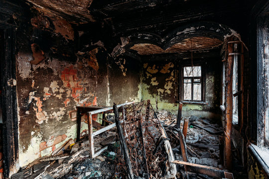 Burnt old rural house interior. Consequences of fire