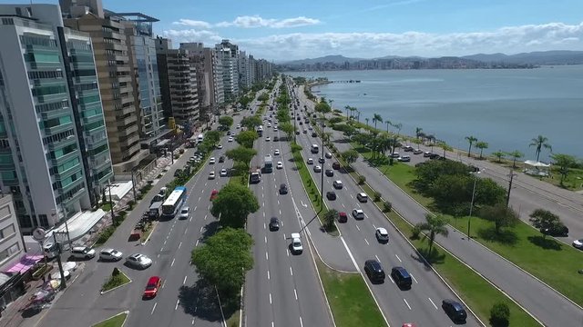 Drone shot of a beach front road with traffic in florian&oacute;polis