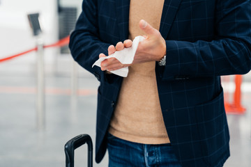 Keep your hands clean. Cropped shot of unrecognizable man disinfects hands with antibacterial...
