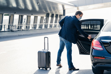 Man arrives from abroad, wears medical mask, returns from country with coronavirus outbreak, needs...