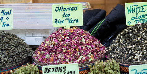 Dried herbal teas close-up. In the round box in front of the store. Healthy and delicious in...