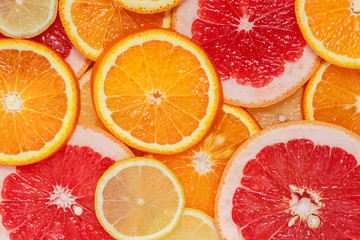 Fresh citruses background: orange, lemon, grapefruit. Citrus flat lay. Top view.
