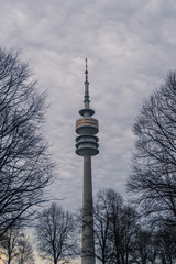 Low Angle View Of Communications Tower Against Cloudy Sky
