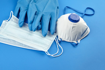 Respirator FFP2, disposable surgical face masks and rubber gloves, protection against coronovirus