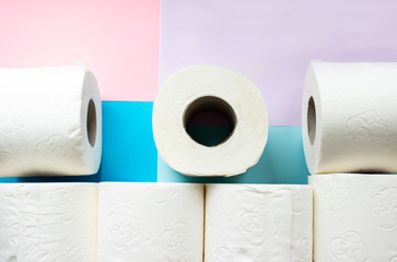 Toilet paper rolls on minimalistic style background. Overhead flat lay format with copy space. Hoarding concept for Coronavirus fear.