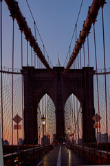 Sunset in middle of Brooklyn Bridge in New York