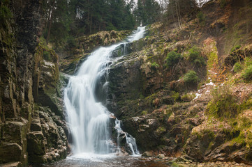 Fototapeta na wymiar Szklarska Poreba Szklarki waterfall, water flows down the rocks.
