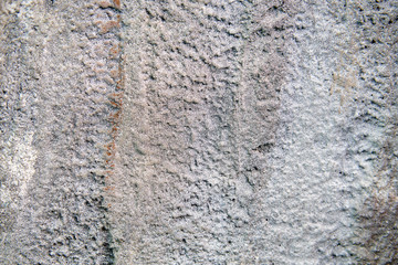 Rough weathered stone wall background, rock texture