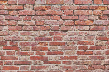 Red cracked brick wall texture