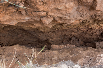 a landslide with cracks in the soil, a close up of the crack inside the clay gorge, safe earth.
