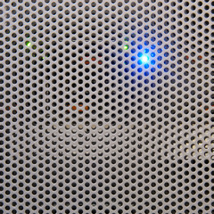 Metal grid with round holes, modern background
