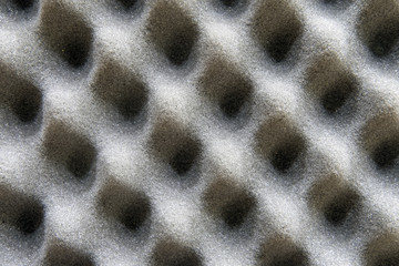 Soft foam soundinsulation pattern as background, texture close-up