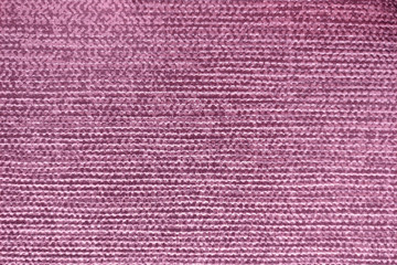 The texture of the paint on the red surface, structural background close-up