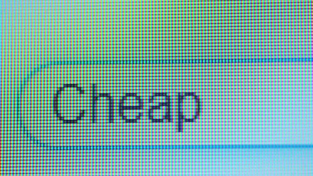 Browser bar with cheap word typed on the computer monitor. Shot in 4k resolution