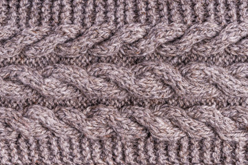 Wool grey knitted texture. Woolen gray cloth, handmade. Textile ornament. Fashion knitwear. Light wool yarn. Fabric texture. Winter scarf. Seamless pattern. Closeup