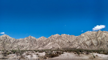 Desert mountain landscape in a sunny day with a blue sky