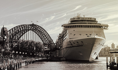 the rocks, Harbor Bridge with a cruise ship stopped waiting for people to disembark.