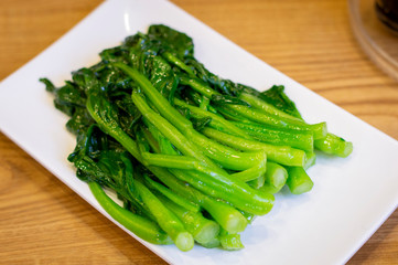 Chinese Stir Fried Green Veggetables in a White Plate