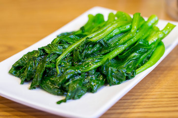 Chinese Stir Fried Green Veggetables in a White Plate