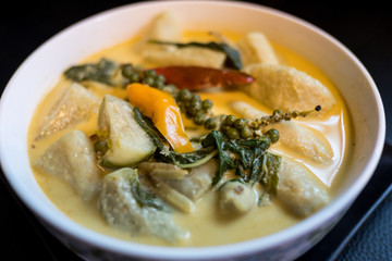 Green curry is a Thai food with fish ball ingredients.