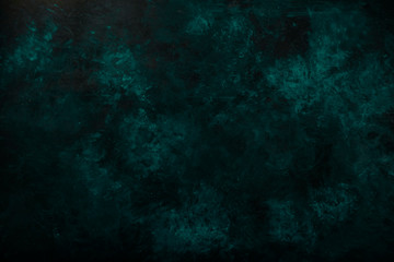 Fototapeta na wymiar Black blue green gray painted concrete texture or background with shadow and grain elements. High contrast and resolution image with place for text. Template for design